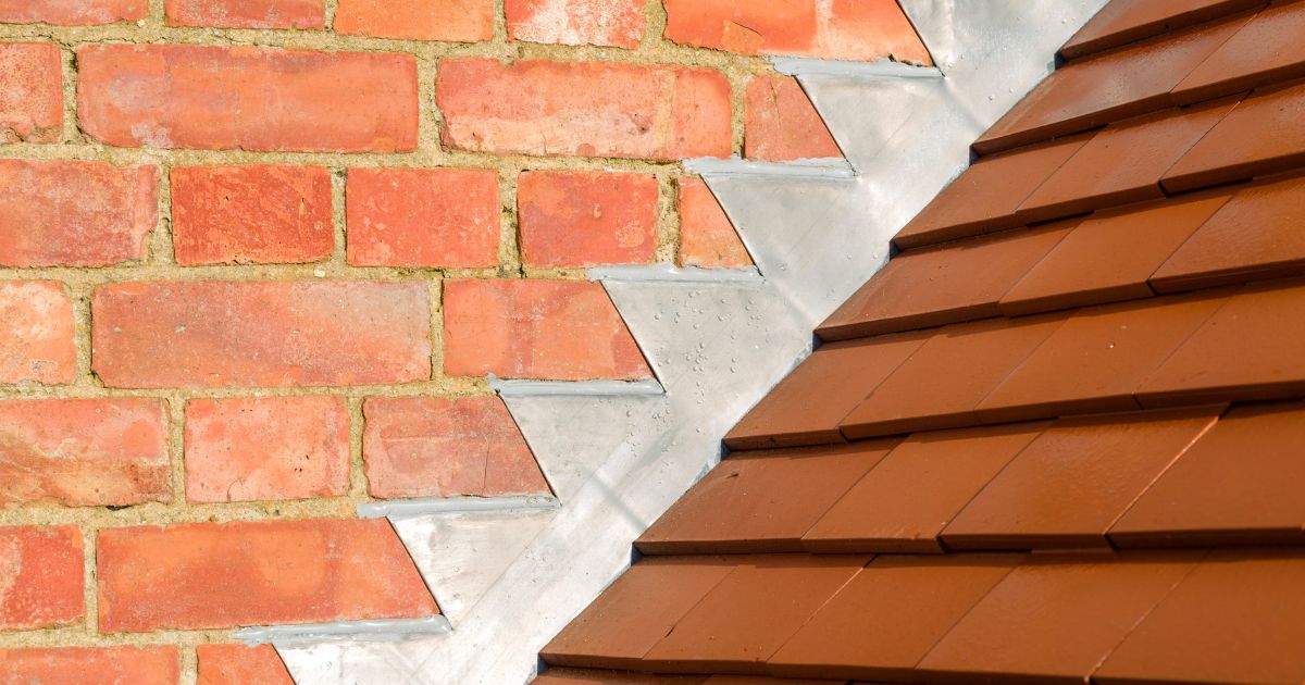 metal flashing stair stepping up a masonry wall