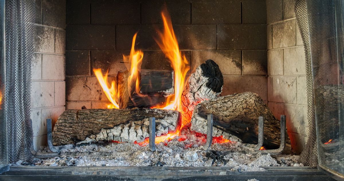wood burning in a blackened firebox