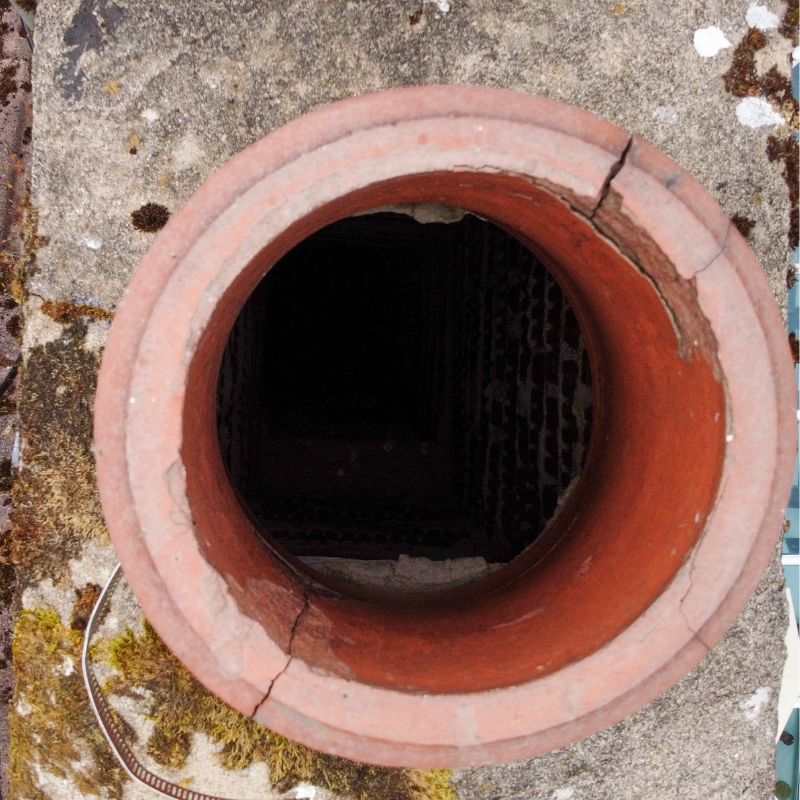 view looking down into a clay chimney flue