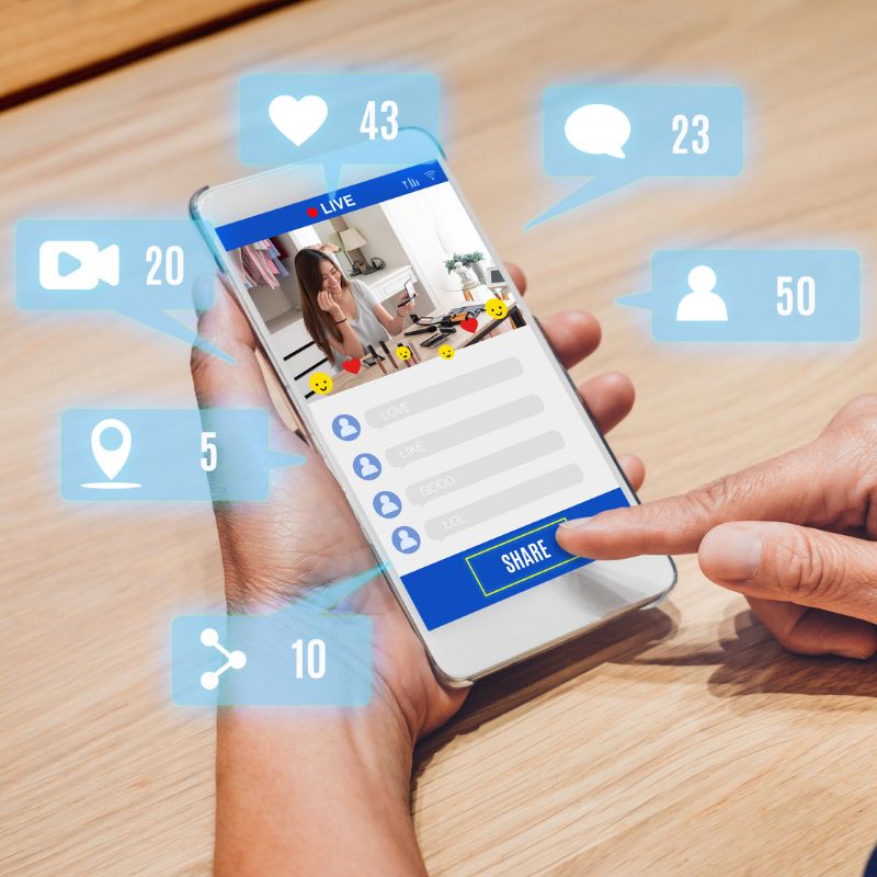 someone looking at a business on a phone to see their likes, reviews, etc.