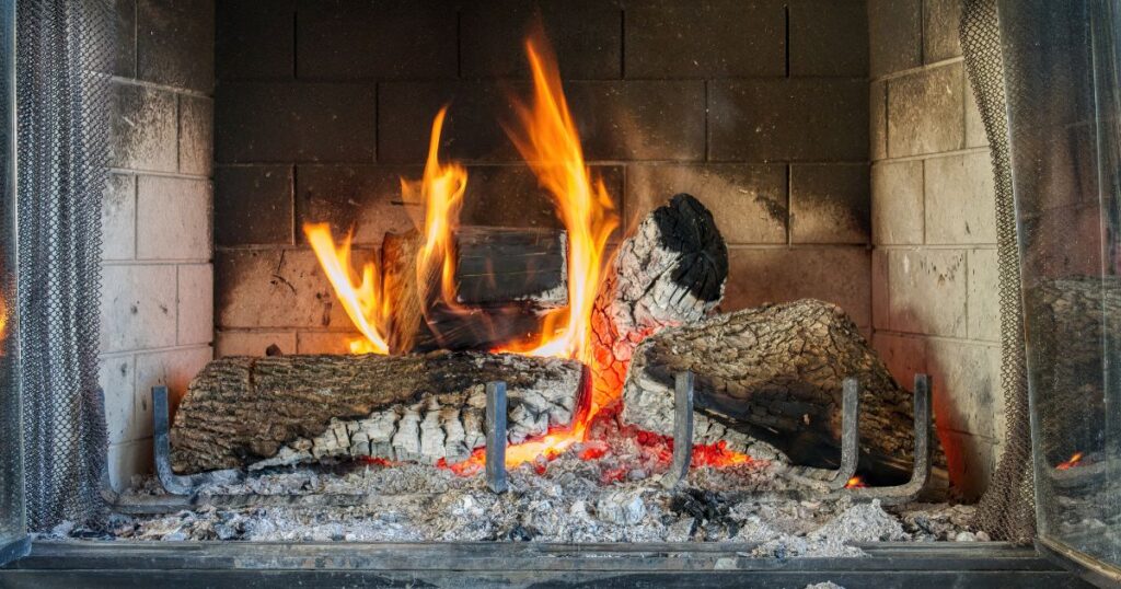 %Imagetitle% | Sureglow Stove &Amp; Chimney wood burning in a blackened firebox