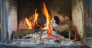 %Title% | Sureglow Stove &Amp; Chimney wood burning in a blackened firebox