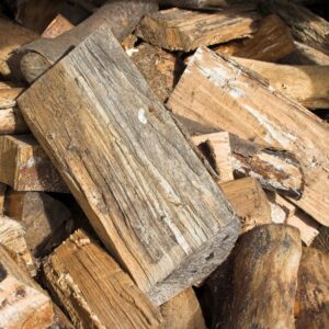 a pile of wood logs throw half-hazardly together
